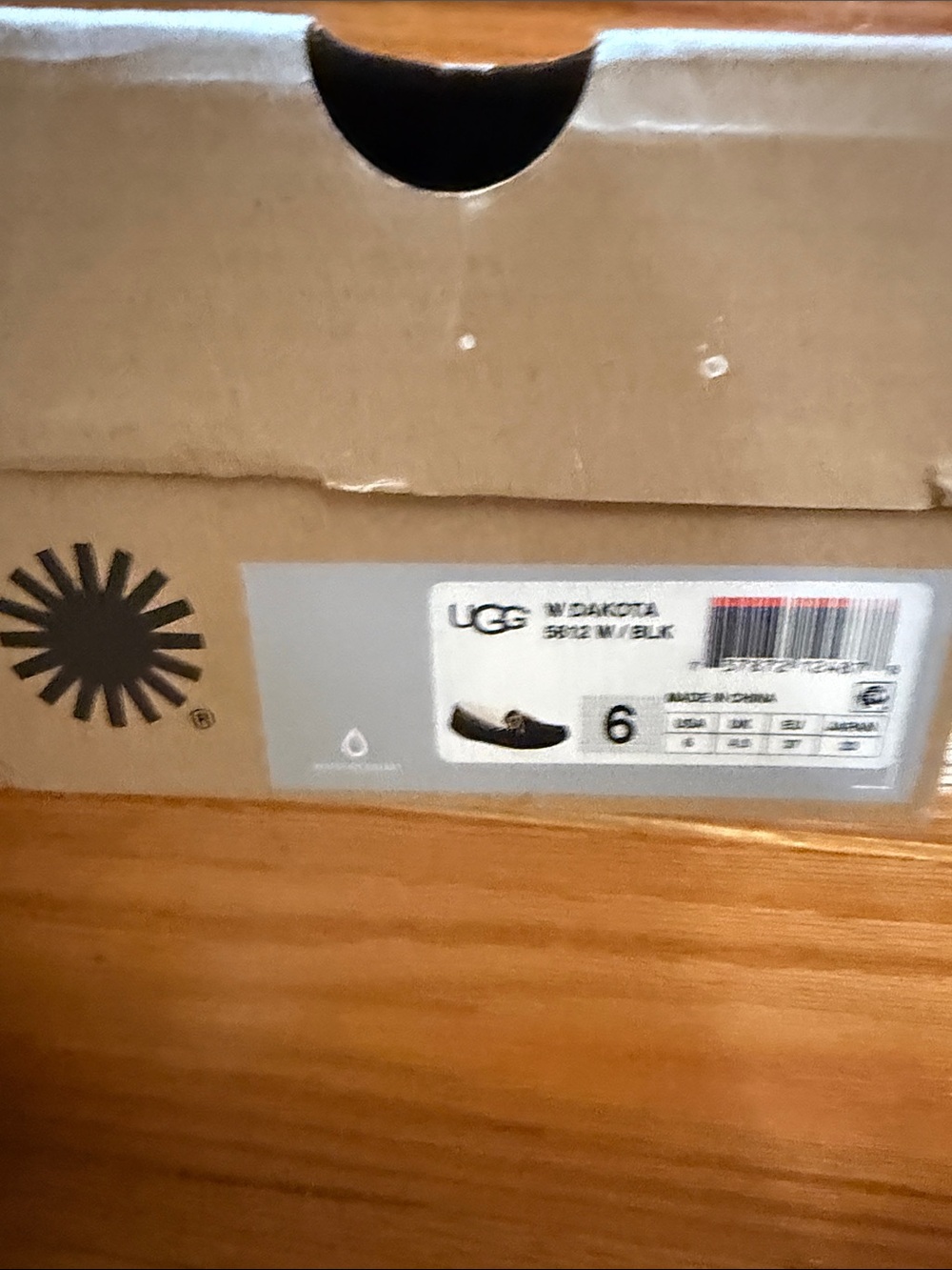 UGG Dakota Slip-On Slippers in Black